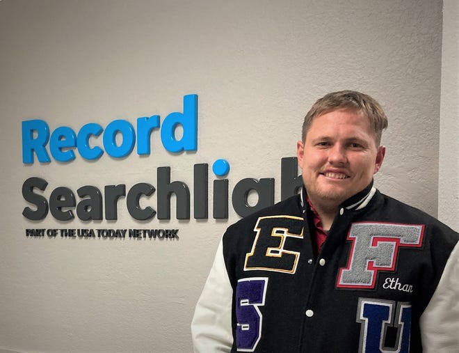 Record Searchlight sports reporter Ethan Hanson wears a letter jacket presented to him in November 2022. The jacket includes the sports letters from numerous North State high schools.