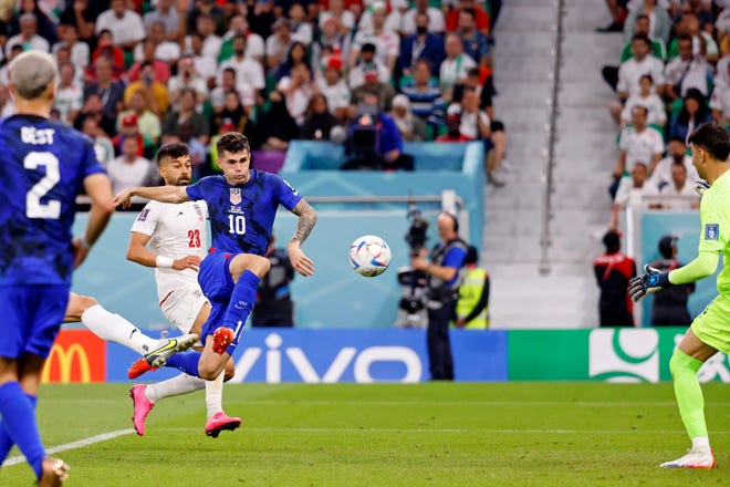 USMNT forward Christian Pulisic scores a goal against Iran during the first half.