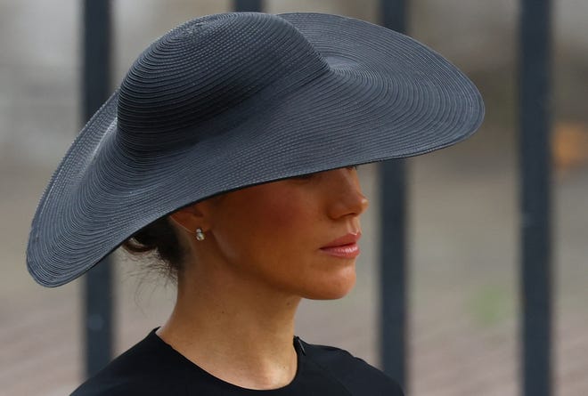 Meghan Duchess of Sussex walks outside Westminster Abbey on the day of the state funeral and funeral of Queen Elizabeth II on September 19, 2022 in London.