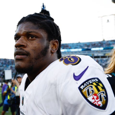 Lamar Jackson walks off the field following Sunday