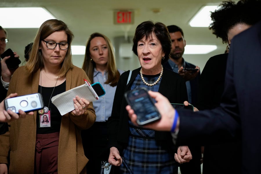 Sen. Susan Collins (R-ME) talks to reporters in the Senate subway on her way to a procedural vote on the Respect For Marriage Act, on which she was the lead Republican sponsor, at the U.S. Capitol on November 28, 2022 in Washington, DC.