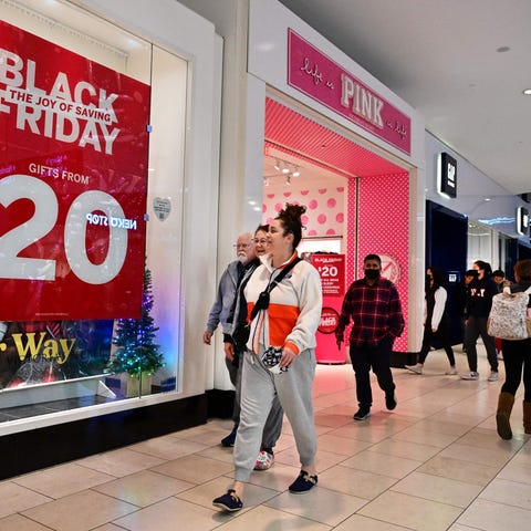 People shop during Black Friday in Santa Anita wit