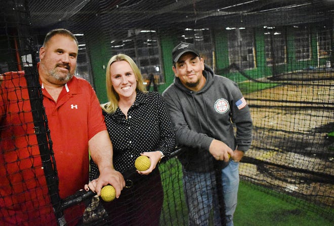 Allen Levrault, Vanessa Levrault and Jimmy Raposa at the new batting cages in Fall River.