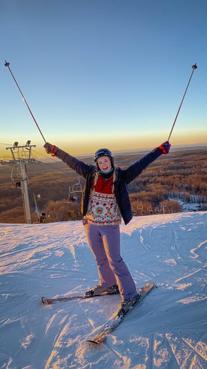 Taylor Dustin, of Grand Rapids, pictured at Boyne Mountain, shares Michigan's travel hot spots and lesser-known gems through her TikTok account "The Wandering Michigander." "I’ve always had something inside me that wanted to explore," she said.