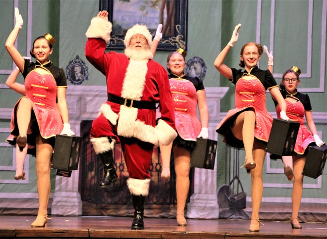 Santa Claus, played by Bruce Cudd, participates in a dance routine with young performers during  rehearsal for "Christmas at the Palace" on Tuesday, Nov. 29, 2022, at the Palace Theatre in downtown Marion. The show runs Friday through Sunday, Dec. 2-4. For ticket information, go to the Palace Theatre website marionpalace.org.