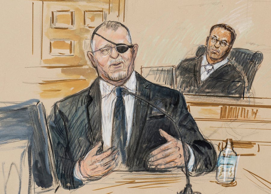This artist sketch depicts the trial of Oath Keepers leader Stewart Rhodes, left, as he testifies before U.S. District Judge Amit Mehta on charges of seditious conspiracy in the Jan. 6, 2021, attack on the U.S. Capitol, in Washington, Nov. 7, 2022. Rhodes was convicted of seditious conspiracy on Nov. 29.