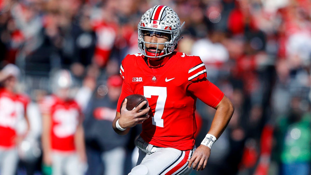 Nov 26, 2022; Columbus, Ohio, USA; Ohio State Buckeyes quarterback C.J. Stroud (7) runs past the Michigan Wolverines defense during the first quarter at Ohio Stadium.