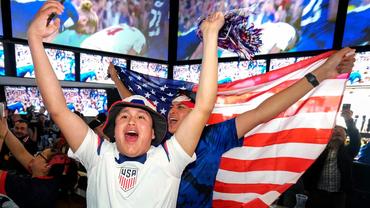 U.S. soccer fans celebrate at a watch party after their team defeated Iran in the Qatar World Cup group B soccer match, in Los Angeles, Tuesday, Nov. 29, 2022.