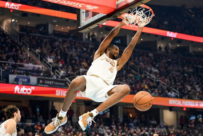 Cleveland Cavaliers forward Evan Mobley dunks during the first half of an NBA basketball game against the Philadelphia 76ers, Wednesday, Nov. 30, 2022, in Cleveland. (AP Photo/Nick Cammett)