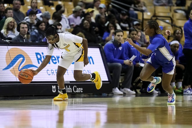Missouri Tigers guard Mama Dembele (4) corals a loose ball during the second half of the Tigers game against the Saint Louis Billikens, Wednesday at Mizzou Arena in Columbia, Mo.