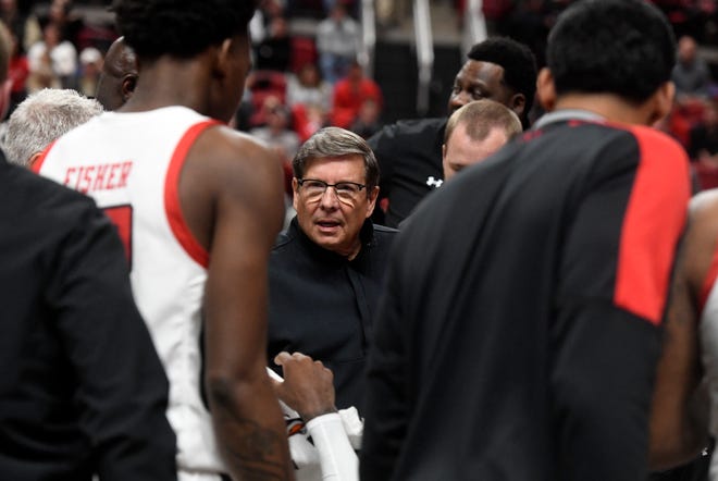 Texas Tech's head coach Mark Adams, center, huddles with the team during the Big East-Big 12 Battle basketball game against Georgetown, Wednesday, Nov. 30, 2022, at United Supermarkets Arena. 