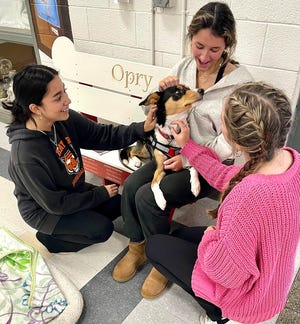 Opry spends time with students at Hingham High School. Kindness and friendship are free.