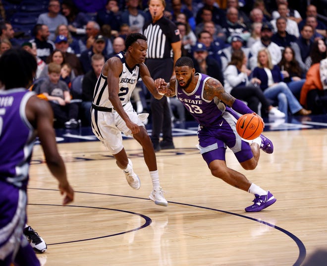 Kansas State guard Desi Sills drives against Butler's Eric Hunter on Wednesday night at Hinkle Fieldhouse in Indianapolis.