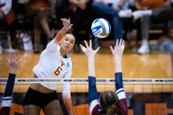 Texas outside hitter Madisen Skinner hits the ball over the net for Texas during the Longhorn's first-round NCAA Championship game against the Fairleigh Dickinson University Knights in Austin, Dec. 1, 2022. The Longhorns triumphed 3-0.