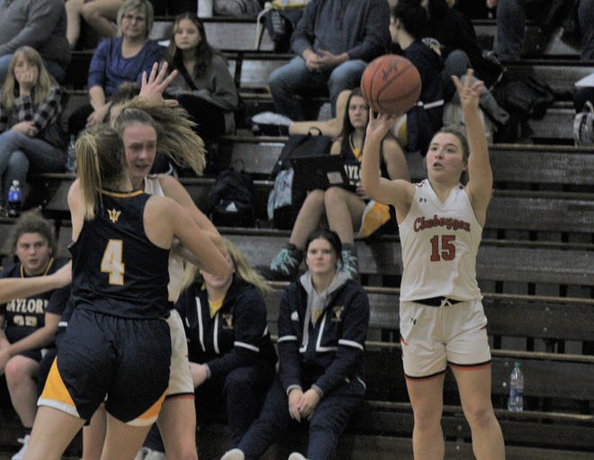 Cheboygan senior point guard Cassidy Jewell (15) fires up a shot during the second quarter of a varsity girls basketball matchup against Gaylord in Cheboygan on Thursday.