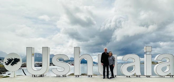 Tom Trusdale and Pam Trusdale stood together in Ushuaia, Argentina.
