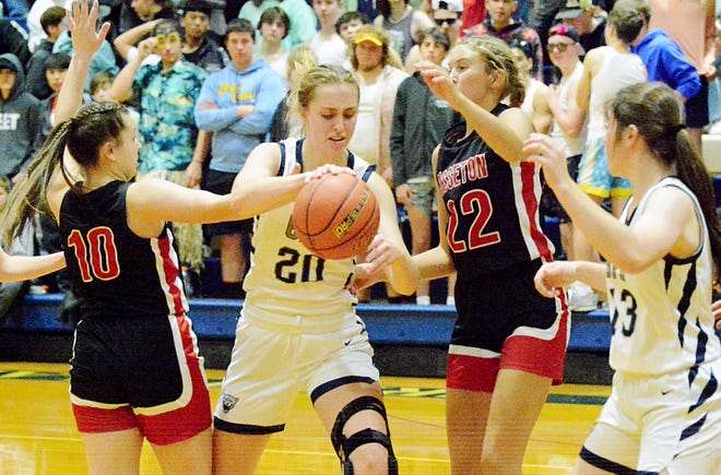 Great Plains Lutheran's Olivia Holmen attempts to drive against Sisseton's Hannah Leverson (10) and Emmalee Nirelsen (22) during their season-opening high school girls basketball game on Thursday, Dec. 1, 2022 in Watertown.