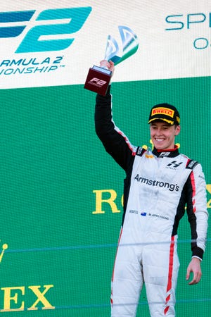 In this photo provided by James Gasperotti, New Zealand driver Marcus Armstrong celebrates after winning a Formula 2 sprint race at the Enzo and Dino Ferrari racetrack, in Imola, Italy, April 23, 2022. Chip Ganassi Racing has signed New Zealand driver Marcus Armstrong to join its IndyCar lineup next season. (James Gasperotti via AP)