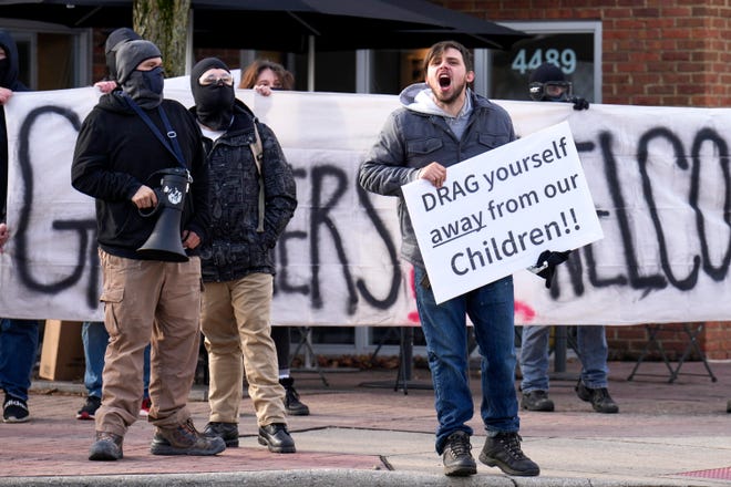 A man standing next to protesters with the far-right, white nationalist Patriot Front group outside of Our Lady of Peace Catholic Church shouts across North High Street on Saturday morning at counter-protesters defending Holi-drag, a planned drag story time reading event at the Red Oak Community School located nearby on West Weisheimer Road.  Proud Boys, another far-right white nationalist group labeled as terrorists by Canada and New Zealand, were also present to protest the drag event, which was canceled due to safety concerns, the school said on social media.