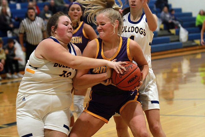 Payton Springstead and Kendalynn Bernheisel battle for a rebound off the glass on Friday