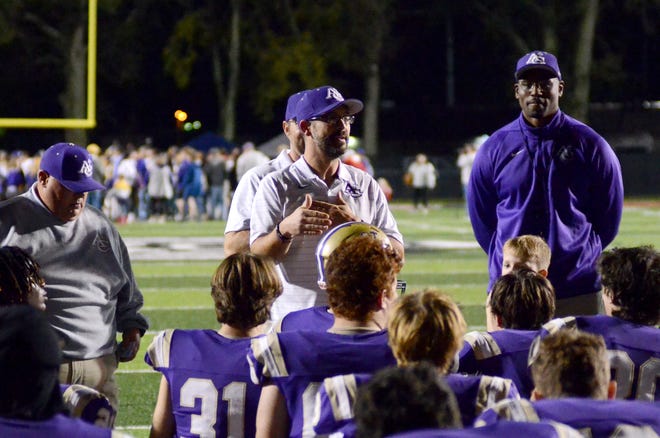 Ascension Catholic head coach Chris Sanders addresses  the team following the Bulldog's win over Opelousas Catholic in the quarterfinal playoff game at Floyd Boutte Memorial Stadium Nov. 25.