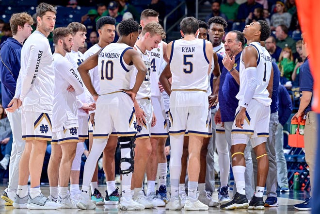 Dec 3, 2022; South Bend, Indiana, USA; Notre Dame Fighting Irish head coach Mike Brey talks to his players during a time out in the first half against the Syracuse Orange at the Purcell Pavilion. Mandatory Credit: Matt Cashore-USA TODAY Sports