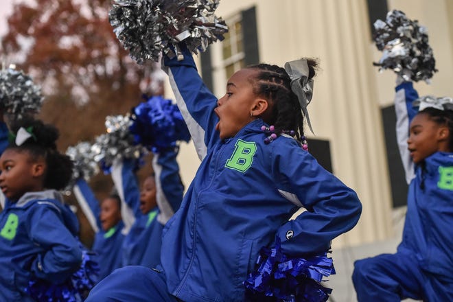 Cheerleaders from Boyd Elementary School perform during Visit Jackson's 'Capital City Lights' holiday tree lighting ceremony at City Hall in Jackson, Miss., Friday, December 2, 2022.