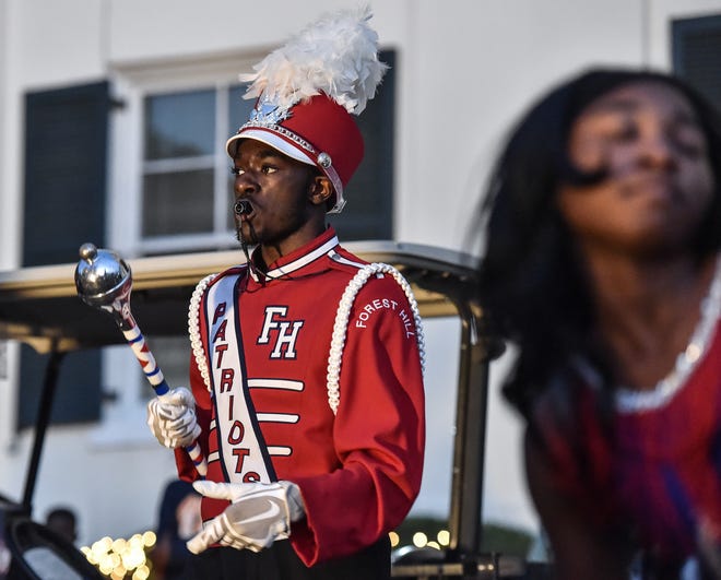 Mari Robinson, 18, performs with the Forest Hill High School Patriots Band during Visit Jackson's 'Capital City Lights' holiday tree lighting ceremony at City Hall in Jackson, Miss., Friday, December 2, 2022.