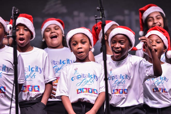 Art Infusion, a group of 2nd and 3rd graders supported by the Greater Jackson Arts Council, performs a holiday dance during Visit Jackson's 'Capital City Lights' holiday tree lighting ceremony at City Hall in Jackson, Miss., Friday, December 2, 2022.