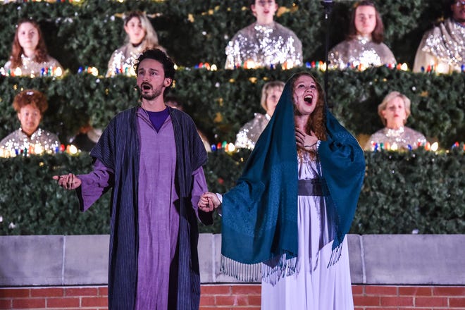 Members of the Belhaven Concert Choir, playing the roles of Joseph and Mary perform at Jackson's annual Singing Christmas Tree at Belhaven's Bowl Stadium in Jackson, Miss., Friday, December 2, 2022.