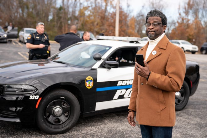 John C. Barnett, a civil rights activist, watches as a demonstrator who police said had an outstanding warrant is arrested before a demonstrating seeking justice for the murder of Emmett Till outside of the home of Carolyn Bryant Donham in Bowling Green, Ky., Saturday, Dec. 3, 2022. Donham is the woman whose accusations led to the murder of Till.