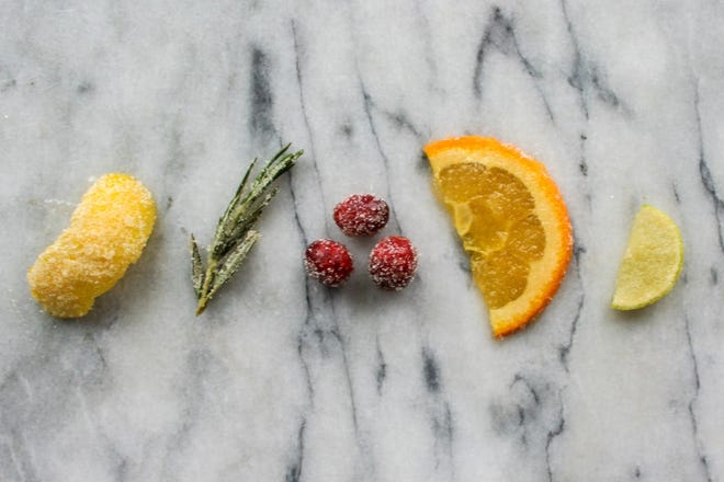 Dipping garnishes like lime or orange slices in granulated sugar can create the illusion of snow.