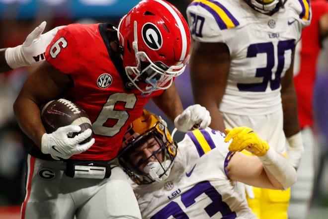 Georgia running back Kenny McIntosh (6) drives in for a touchdown during the second half of the SEC Championship NCAA college football game between LSU and Georgia in Atlanta, on Saturday, Dec. 3, 2022. Georgia won 50-30.