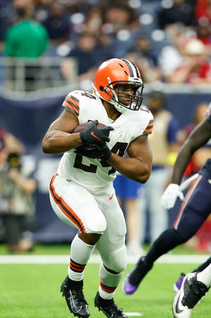 Cleveland Browns running back Nick Chubb (24) carries the ball during an NFL football game against the Houston Texans on Sunday, December 4, 2022, in Houston. (AP Photo/Matt Patterson)