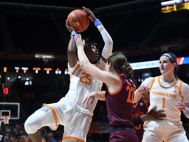 Tennessee guard Jordan Horston (25) shoots and scores against Virginia Tech guard Cayla King (22) during the NCAA college basketball game between the Tennessee Lady Vols and Virginia Tech Hokies in Knoxville, Tennessee, on Sunday, December 4, 2022. 
