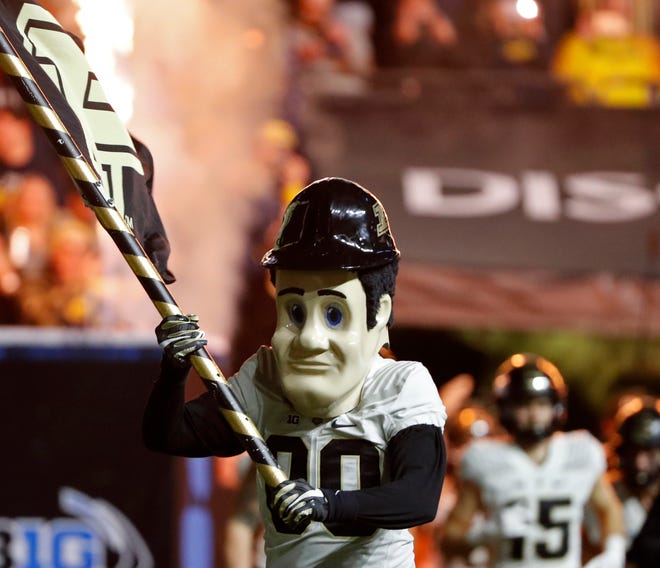 Purdue Pete leads the Boilermaker football team onto the field during the Big Ten Championship against Michigan on Saturday, Dec. 3, 2022 at Lucas Oil Stadium.