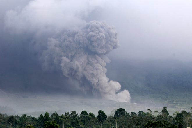 Pyroclastic flow rolls down the slope of Mount Semeru during an eruption on Sunday, Dec. 4, 2022 in Lumajang, East java, Indonesia.