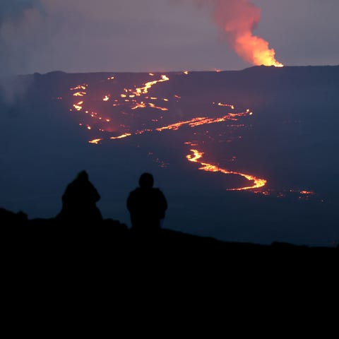 HILO, HAWAII - DECEMBER 04: People watch the erupt