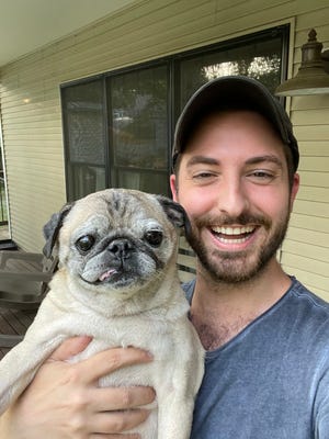 Noodle the pug and Jonathan Graziano.