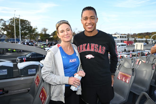 Amy Robach and TJ Holmes run during the 2022 TCS New York City Marathon on November 06, 2022 in New York City