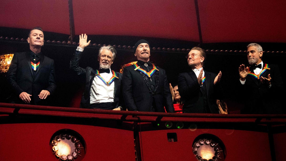 (L-R) Honorees U2 bandmembers Irish musicians Larry Mullen Jr, Adam Clayton, The Edge, Bono and actor George Clooney attend the 45th Kennedy Center Honors at the John F. Kennedy Center for the Performing Arts in Washington, DC, on Dec. 4, 2022.