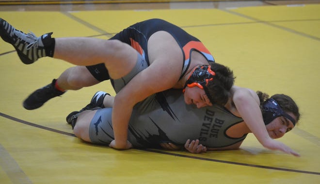 Cheboygan's Devihn Wichlacz (left) grapples with a Sault Ste. Marie wrestler during a Straits Area Conference match in Pellston last season. Wichlacz, now a senior, is back to lead the Cheboygan wrestlers this winter.