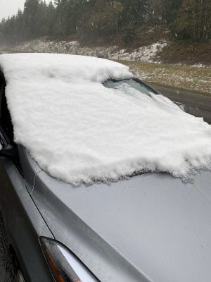 Washington State authorities handed out a $553 ticket to a driver who traveled more than 5 miles with the windshield almost completely covered in snow.