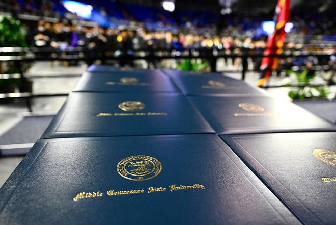 New diploma covers are stacked neatly on the stage in Middle Tennessee State University's Murphy Center, waiting to be presented to graduates in a recent commencement ceremony. TMTSU’s fall Class of 2022 is scheduled to receive their degrees Saturday, Dec. 10, in ceremonies at 9 a.m. and 2 p.m. Central during the university’s fall 2022 commencement ceremonies. (MTSU file photo by J. Intintoli)