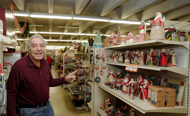 Ed Evanoff points out some of his Christmas themed offerings at his store, Tuesday, December 6, 2022, in Sheboygan Falls, Wis.