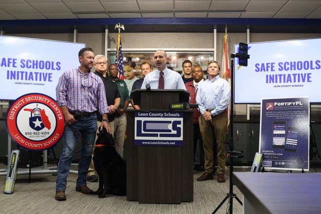 Leon County Schools Superintendent Rocky Hanna, center, speaks  at a press conference at the district's safety and security portable on Tuesday, Dec. 6, 2022.