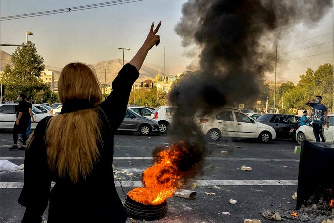 Iranians protests the death of 22-year-old Mahsa Amini after she was detained by the morality police in Tehran.