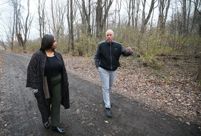Akron City Council President Margo Sommerville and Akron Mayor Dan Horrigan talk about the White Pond development property as they toured the city owned site on Tuesday in Akron.