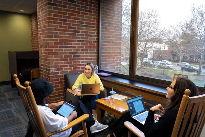 Dayrna Zaitseva, a student at Capital University in Bexley who was born in Ukraine, talks with fellow students Julian Tugaoen, left, and Christina Mickelson, right, at Blackmore Library on campus. Zaitseva is the recipient of a new scholarship for Ukrainian students studying in America.