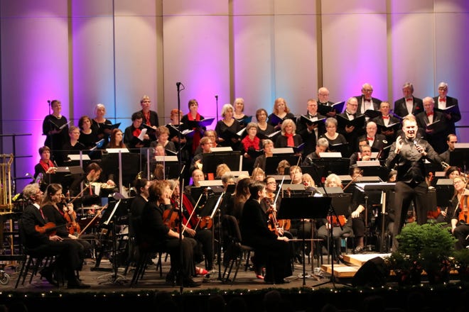 The Adrian Symphony Orchestra, conducted by Bruce Anthony Kiesling, is joined by the Lenawee Community Chorus at the ASO's holiday pops concert in 2019.
